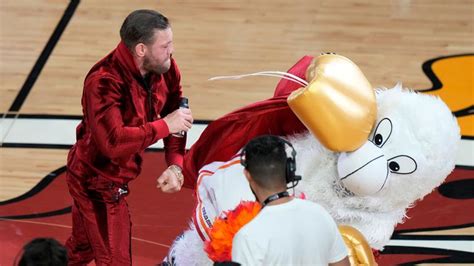 Mcgregor connecting with a punch on the mascot